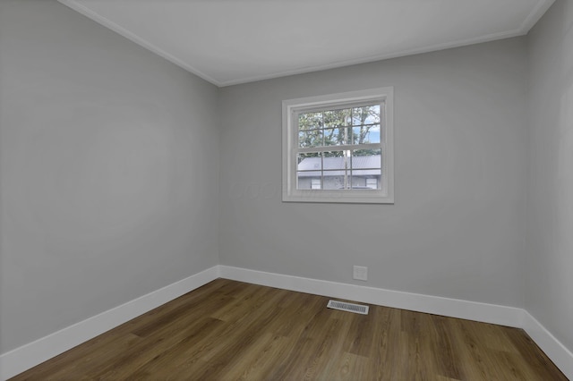193 Seymour Ave, Buckeye Lake, OH 43008 - empty room with baseboards, crown molding, and dark wood finished floors