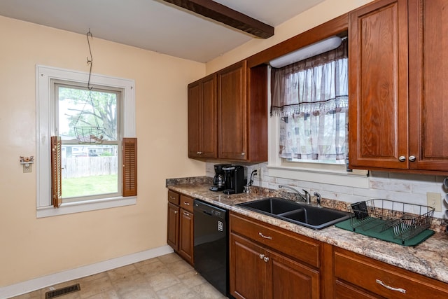 kitchen with dishwasher, a sink, baseboards, brown cabinets, and beamed ceiling