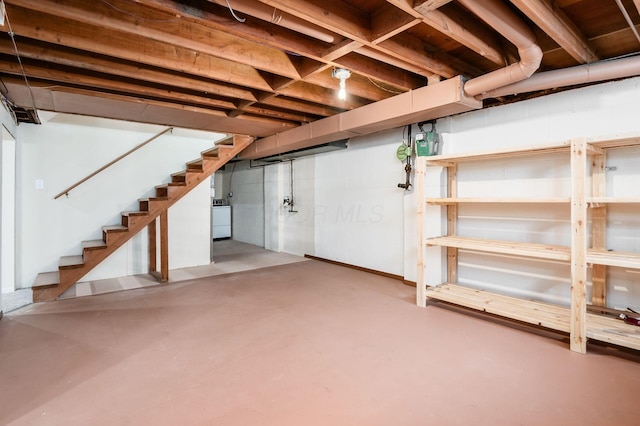 1825 Ormond Ave, Columbus, OH 43224 - unfinished basement featuring washer / dryer and stairway