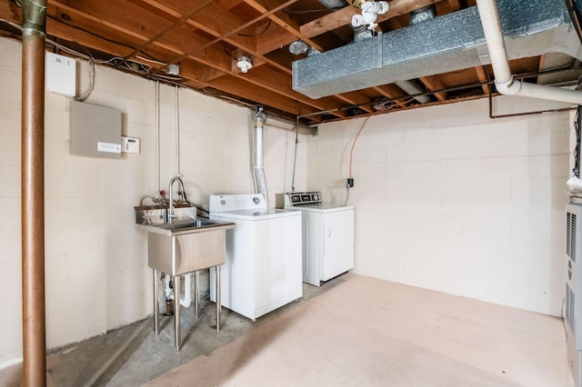 1825 Ormond Ave, Columbus, OH 43224 - laundry room featuring independent washer and dryer and concrete block wall