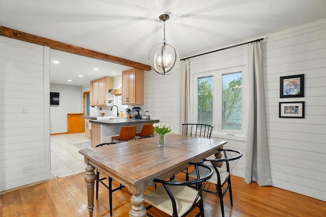 dining space featuring light wood-style flooring, a chandelier, and recessed lighting