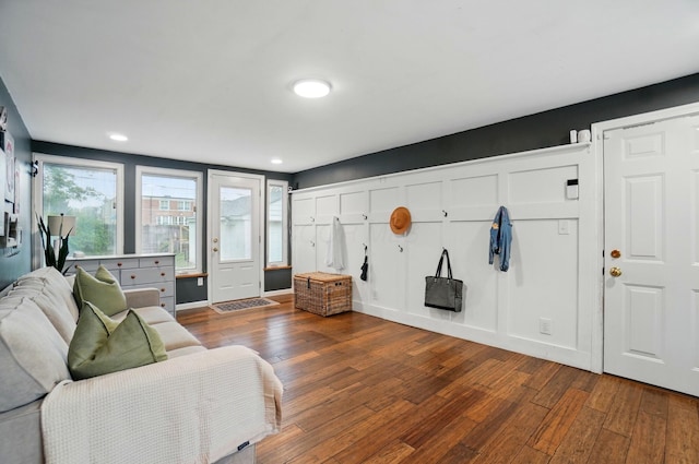 living area featuring hardwood / wood-style flooring, recessed lighting, and baseboards