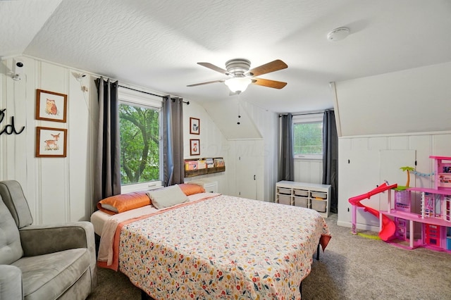 bedroom featuring lofted ceiling, carpet floors, and a ceiling fan