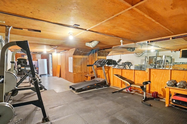 workout area with wood walls