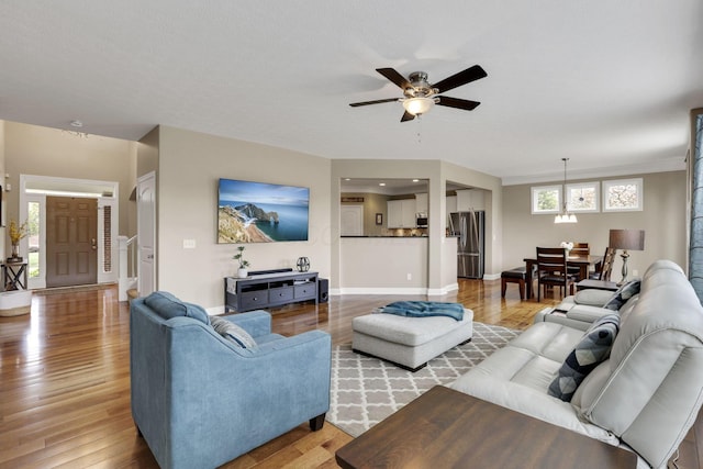 4919 Nadine Park Dr, Hilliard, OH 43026 - living area with a ceiling fan, light wood-type flooring, and baseboards