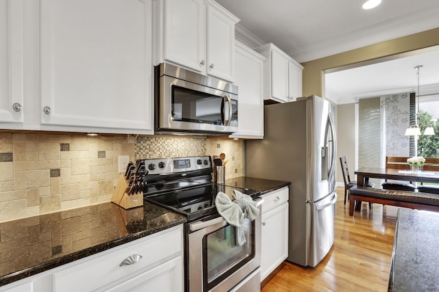 4919 Nadine Park Dr, Hilliard, OH 43026 - kitchen featuring stainless steel appliances, white cabinetry, ornamental molding, light wood-type flooring, and backsplash