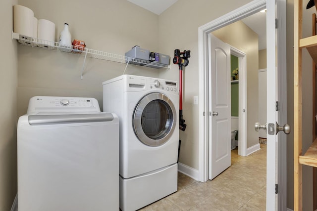 4919 Nadine Park Dr, Hilliard, OH 43026 - clothes washing area with separate washer and dryer, light tile patterned flooring, and baseboards