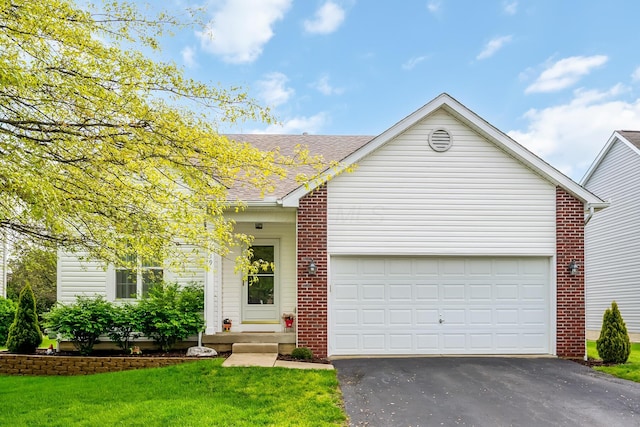 119 Harvard Loop, Delaware, OH 43015 - view of front facade featuring driveway, brick siding, an attached garage, a shingled roof, and a front yard