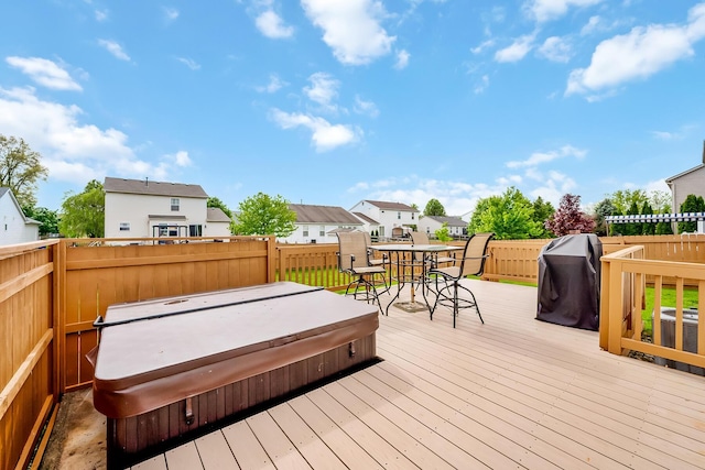 119 Harvard Loop, Delaware, OH 43015 - deck with a covered hot tub, a fenced backyard, outdoor dining area, a grill, and a residential view
