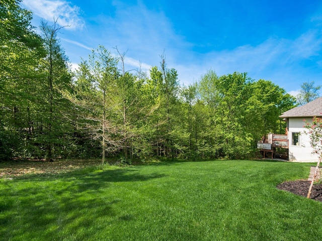 9378 Pine Creek Dr, Powell, OH 43065 - view of grassy yard with a wooden deck