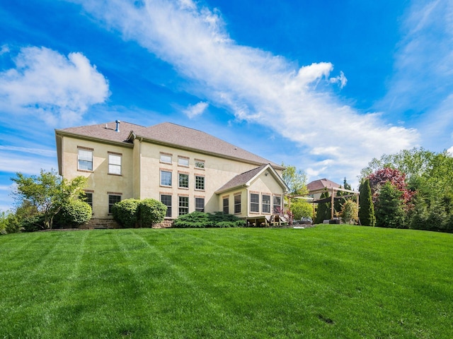 9378 Pine Creek Dr, Powell, OH 43065 - back of property with a lawn and stucco siding