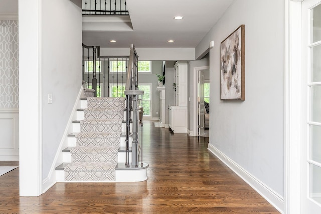 9378 Pine Creek Dr, Powell, OH 43065 - stairway with wood finished floors, recessed lighting, and baseboards