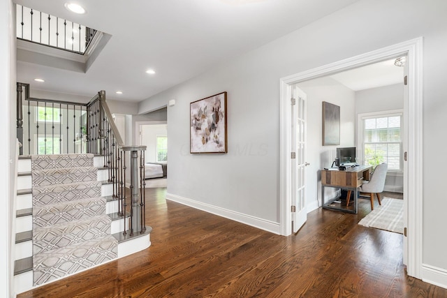 9378 Pine Creek Dr, Powell, OH 43065 - staircase featuring wood finished floors, plenty of natural light, baseboards, and recessed lighting