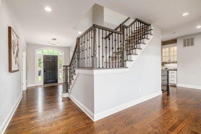 9378 Pine Creek Dr, Powell, OH 43065 - foyer entrance with stairs, wood finished floors, baseboards, and recessed lighting