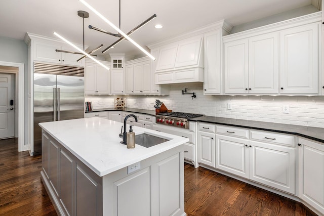 9378 Pine Creek Dr, Powell, OH 43065 - kitchen featuring a sink, stainless steel appliances, white cabinetry, decorative backsplash, and recessed lighting