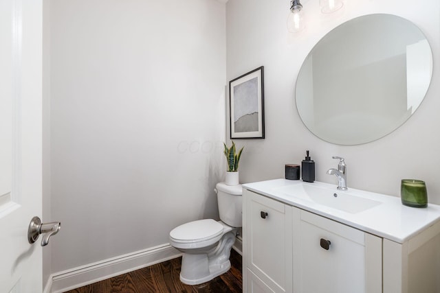 9378 Pine Creek Dr, Powell, OH 43065 - half bath with toilet, wood finished floors, vanity, and baseboards