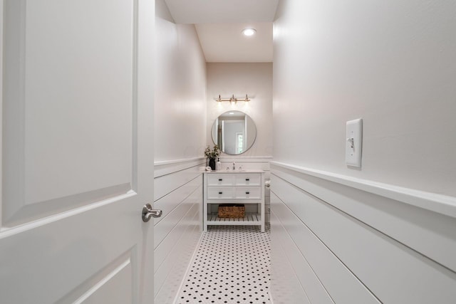 9378 Pine Creek Dr, Powell, OH 43065 - bathroom featuring vanity, recessed lighting, wainscoting, and a decorative wall