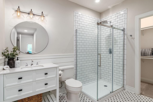 9378 Pine Creek Dr, Powell, OH 43065 - bathroom featuring a shower stall, vanity, toilet, and recessed lighting