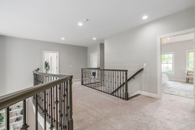 9378 Pine Creek Dr, Powell, OH 43065 - hall with an upstairs landing, carpet floors, baseboards, and recessed lighting