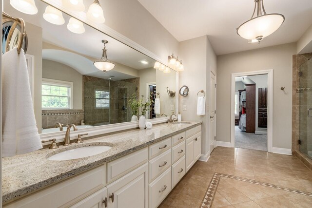 9378 Pine Creek Dr, Powell, OH 43065 - bathroom with a stall shower, double vanity, baseboards, and tile patterned flooring