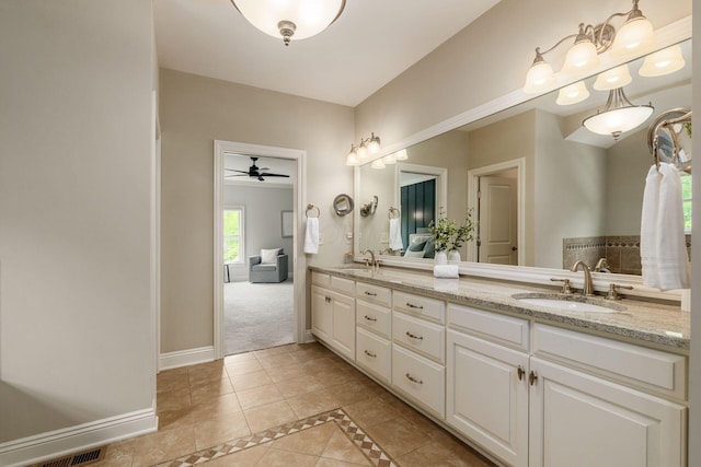9378 Pine Creek Dr, Powell, OH 43065 - bathroom featuring tile patterned floors, double vanity, a ceiling fan, baseboards, and inlaid floor details