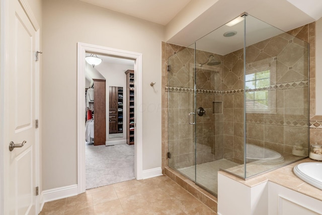 9378 Pine Creek Dr, Powell, OH 43065 - bathroom with a shower stall, a spacious closet, tile patterned flooring, and baseboards