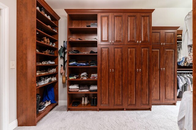 9378 Pine Creek Dr, Powell, OH 43065 - walk in closet with light colored carpet