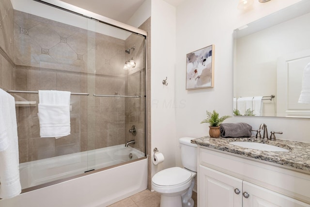 9378 Pine Creek Dr, Powell, OH 43065 - full bath with toilet, shower / bath combination with glass door, vanity, and tile patterned flooring