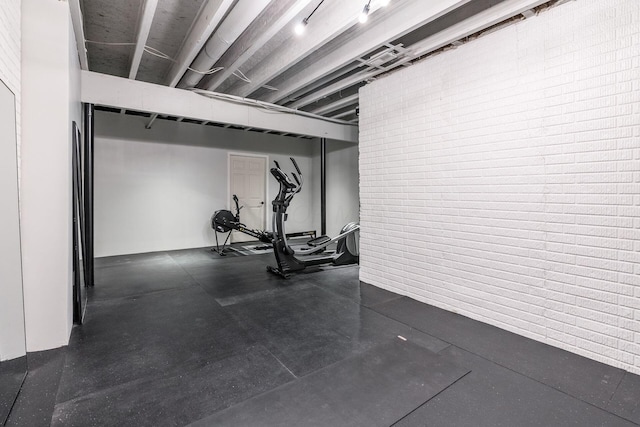 9378 Pine Creek Dr, Powell, OH 43065 - workout area with brick wall