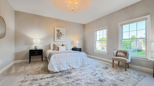 9378 Pine Creek Dr, Powell, OH 43065 - bedroom with carpet flooring, a chandelier, and baseboards