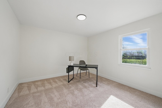 home office with carpet flooring and baseboards