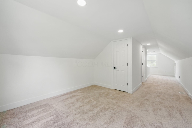 bonus room featuring carpet, vaulted ceiling, recessed lighting, and baseboards