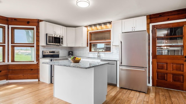 255 S Preston St, Centerburg, OH 43011 - kitchen with appliances with stainless steel finishes, a sink, a center island, and light wood finished floors