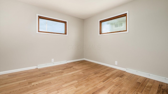 255 S Preston St, Centerburg, OH 43011 - empty room with plenty of natural light, light wood-style flooring, and baseboards