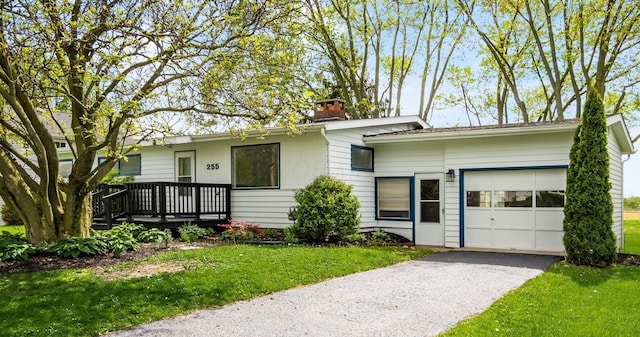 255 S Preston St, Centerburg, OH 43011 - ranch-style home featuring an attached garage, a chimney, a front lawn, and asphalt driveway