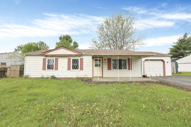 315 Redmond Rd, Columbus, OH 43228 - ranch-style home with an attached garage, driveway, a porch, and a front lawn