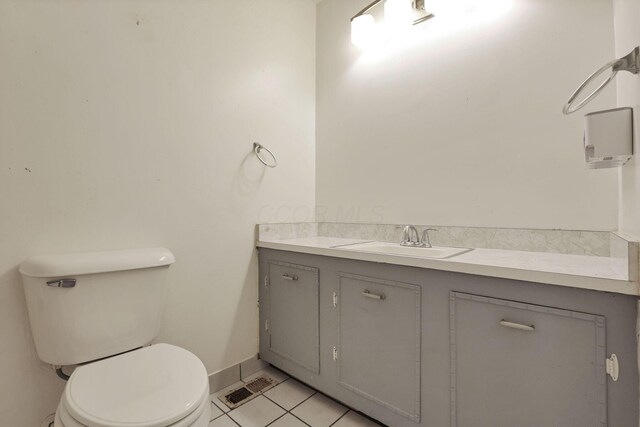315 Redmond Rd, Columbus, OH 43228 - bathroom featuring toilet, vanity, tile patterned flooring, and baseboards