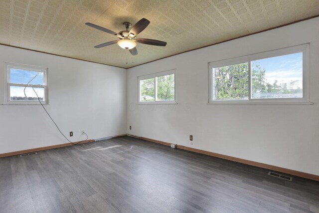 315 Redmond Rd, Columbus, OH 43228 - unfurnished room with wood finished floors, baseboards, an ornate ceiling, and ceiling fan