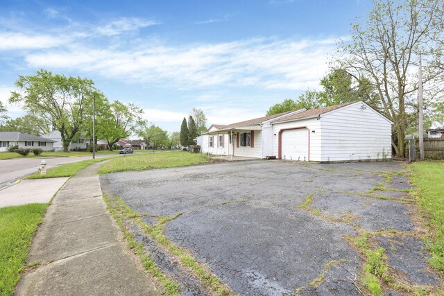 315 Redmond Rd, Columbus, OH 43228 - view of front facade featuring an attached garage, driveway, and fence