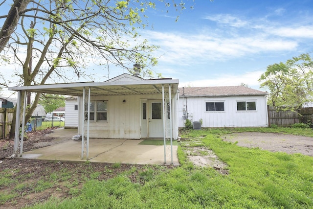 315 Redmond Rd, Columbus, OH 43228 - back of house featuring fence, a patio area, and central air condition unit