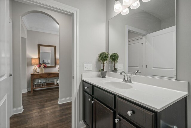 6678 Trinity Mist Way, Delaware, OH 43015 - bathroom with wood finished floors, baseboards, vanity, and crown molding