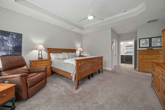 6678 Trinity Mist Way, Delaware, OH 43015 - bedroom with a raised ceiling, light colored carpet, crown molding, baseboards, and ensuite bathroom