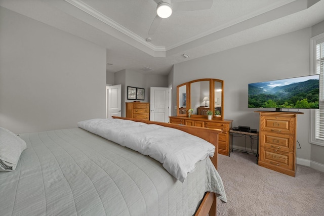 6678 Trinity Mist Way, Delaware, OH 43015 - bedroom with light colored carpet, crown molding, a tray ceiling, a ceiling fan, and baseboards