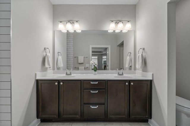6678 Trinity Mist Way, Delaware, OH 43015 - bathroom featuring double vanity, toilet, and baseboards