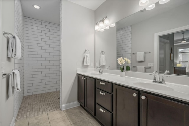 6678 Trinity Mist Way, Delaware, OH 43015 - bathroom featuring double vanity, a tile shower, tile patterned flooring, and baseboards