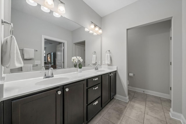 6678 Trinity Mist Way, Delaware, OH 43015 - full bath with double vanity, toilet, tile patterned flooring, and baseboards