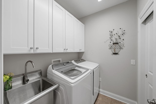 6678 Trinity Mist Way, Delaware, OH 43015 - laundry room with cabinet space, washing machine and dryer, baseboards, and tile patterned floors