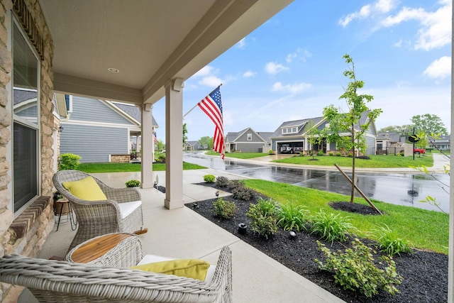 6678 Trinity Mist Way, Delaware, OH 43015 - view of patio / terrace with a porch, a residential view, and a water view