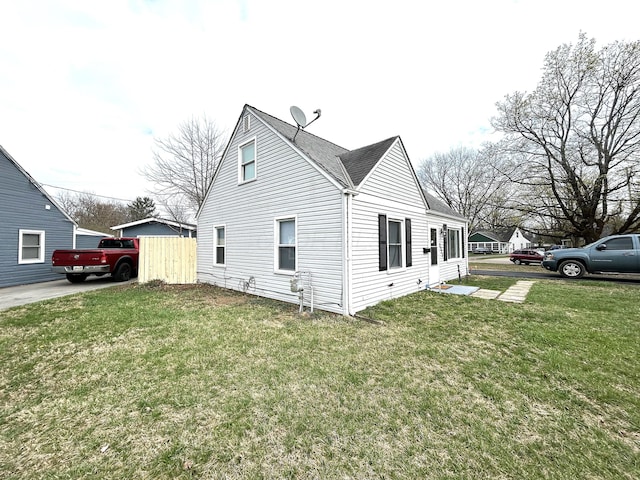 2322 Mecca Rd, Columbus, OH 43224 - view of home's exterior with a yard and roof with shingles