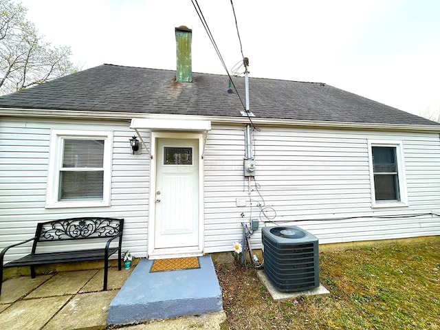 2322 Mecca Rd, Columbus, OH 43224 - property entrance with central air condition unit and a shingled roof